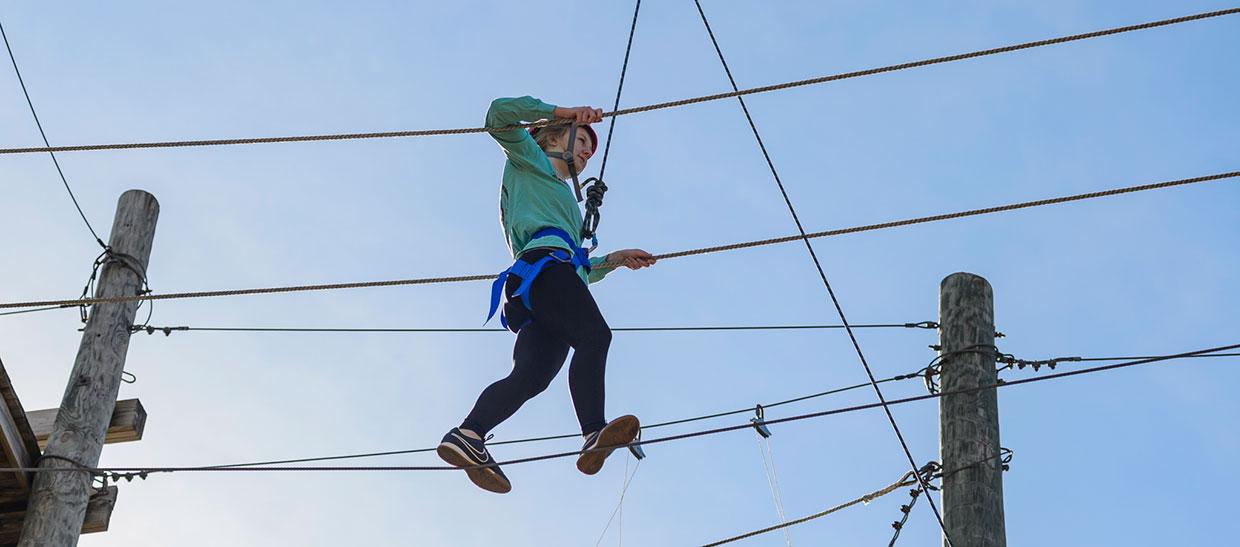 Woman on the high ropes course